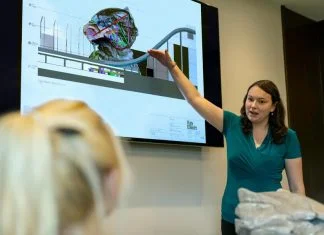 Female Engineer Holding Presentation for cloud environments