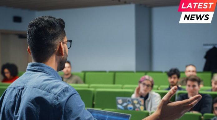 Imperial Business School Pushes for Deeper Sustainability in Teaching Male Teacher Giving a Lecture to a Diverse Multiethnic Group of Female and Male Students in Modern College Room