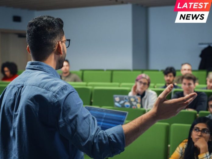 Male Teacher Giving a Lecture to a Diverse Multiethnic Group of Female and Male Students in Modern College Room