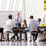 What is Organizational Agility (And How Do Companies Achieve It)? Senior Businessman Leading Meeting about organizational agility At Boardroom Table