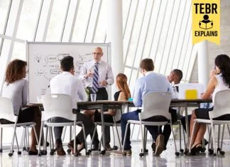 Senior Businessman Leading Meeting about organizational agility At Boardroom Table