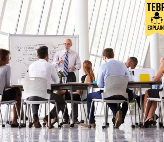 Senior Businessman Leading Meeting about organizational agility At Boardroom Table