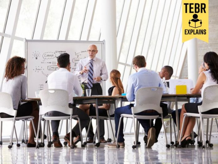 Senior Businessman Leading Meeting about organizational agility At Boardroom Table