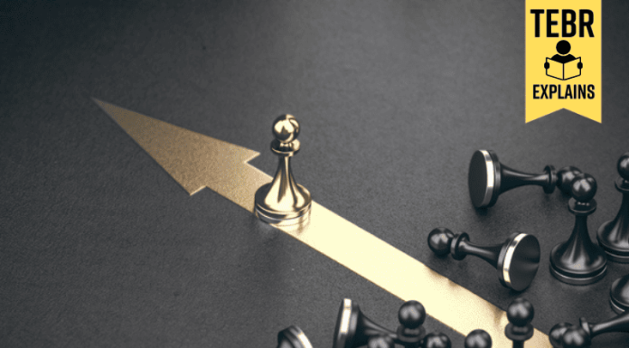 Golden pawn beating competition over black background. Business competitive