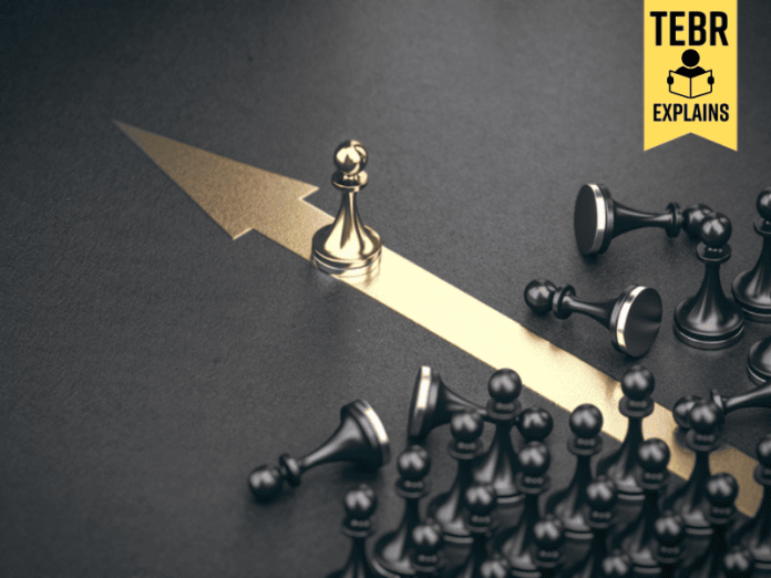 Golden pawn beating competition over black background. Business competitive