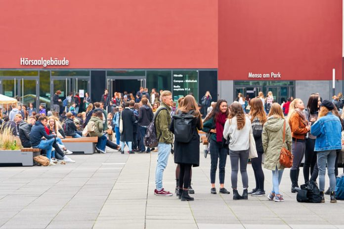 German students on the university campus in Leipzig during a break in Germany