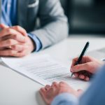 Unpacking the Fine Print: Why Contract Transparency Matters in Business Dealings Signing contract on a meeting