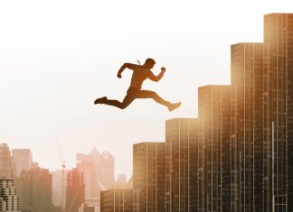 Leap and Run Framework: Breaking Free from Incrementalism Young businessman jumping high and leap on staircase, celebrate success winning pose on building rooftop.