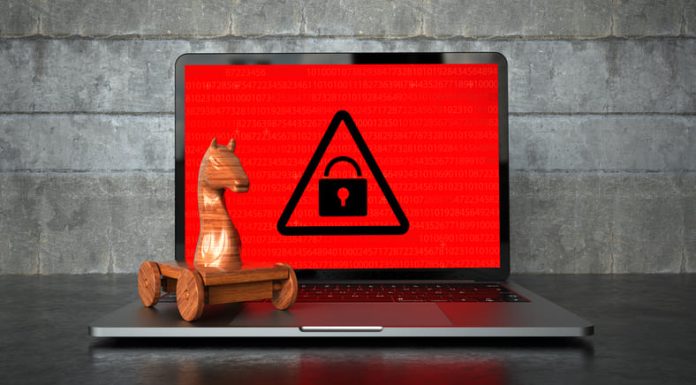Trojan Proxies: What they are and What are their Benefits? Encrypted notebook with a wooden trojan horse on the table