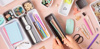 Desktop organization. Cleaning up messy stationery in plastic organizers for office and home desk