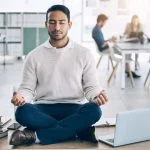 Meditation, relax or businessman with laptop, books or zen peace in office desk for work mindfulness, wellness or mental health