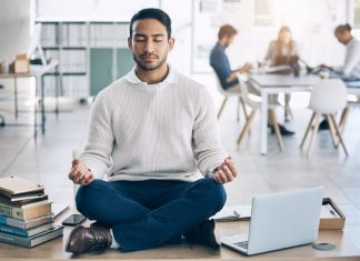 Mindful Leadership: How Practicing Presence Can Elevate Your Business Game Meditation, relax or businessman with laptop, books or zen peace in office desk for work mindfulness, wellness or mental health