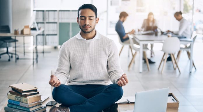 Mindful Leadership: How Practicing Presence Can Elevate Your Business Game Meditation, relax or businessman with laptop, books or zen peace in office desk for work mindfulness, wellness or mental health