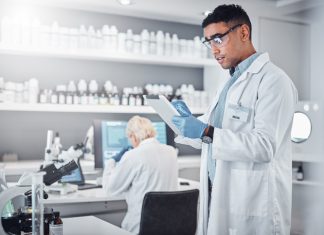 Scientist, tablet and clinical research innovation in laboratory for medical analytics, science development or biotech neuroscience.