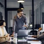 A focused businessman is having a discussion about strategic project at the office.