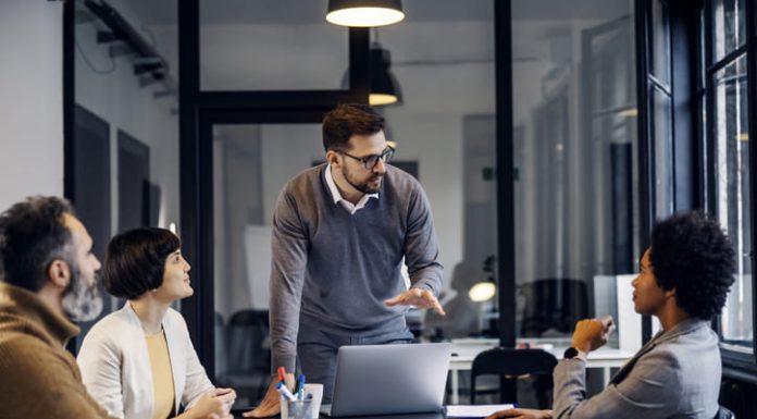 A focused businessman is having a discussion about strategic project at the office.