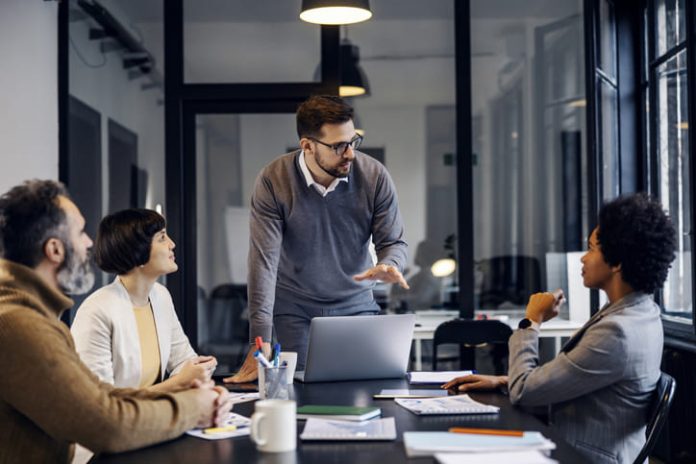 A focused businessman is having a discussion about strategic project at the office.