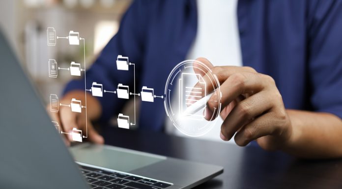 Document management system and records concept (DMS), Businessman working laptop virtual screen icons folder and document management system, Software for archiving, Searching and managing files corporate document