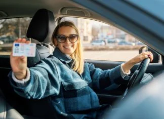 Driving in Germany with an EU License Legal Rules and Validity Woman holding a driver's license in Germany