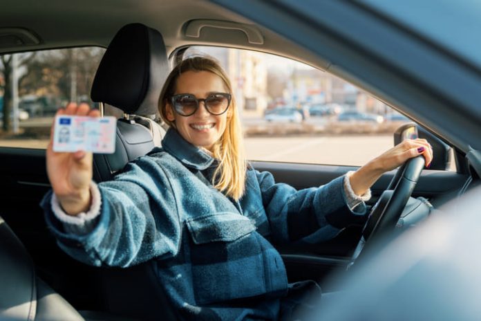 Woman holding a driver's license in Germany