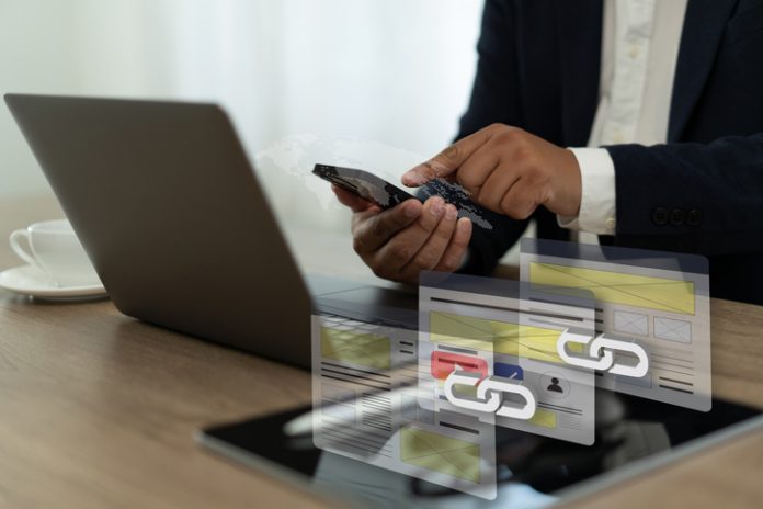 Backlinks laptop to access a website, and the website is linked Backlinks Technology Online Web