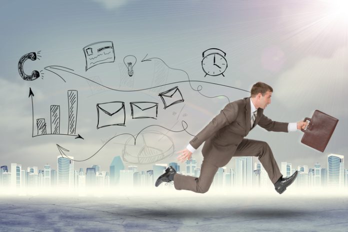 Businessman running high speed with suitcase