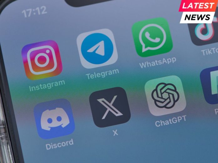 iphone on a table showing icons of the apps instagram, telegram, tiktok, twitter, discord, telegram, chatgpt and paypal
