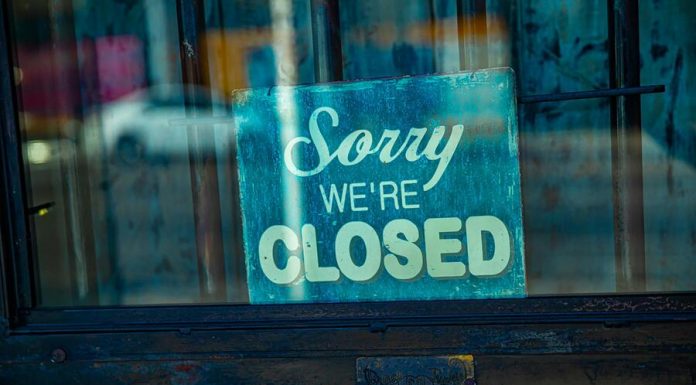 company close signage on a glass door