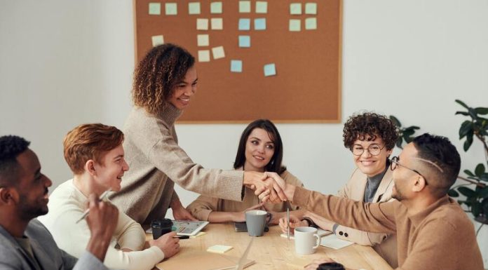 Colleagues Shaking each other's Hands during training