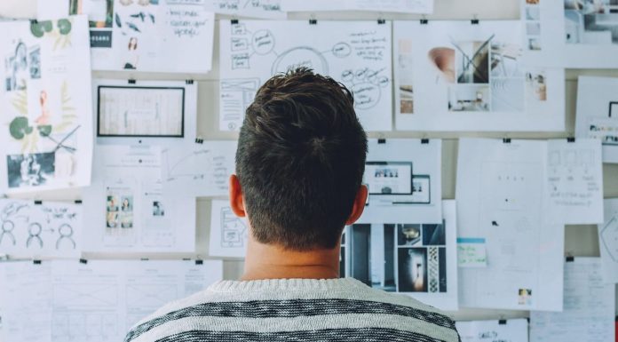 Man staring at the whiteboard thinking about Internet Backup