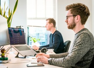 Leading with AI: How Real-Time Agent Assist Boosts Team Performance Developers working hard for an AI agent