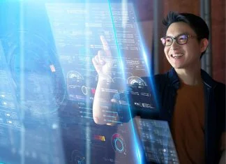 Generative AI In Innovation Development: A Catalyst For Creative Disruption AI - man pointing to the screen