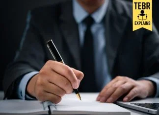 Businessman writing an elevator pitch