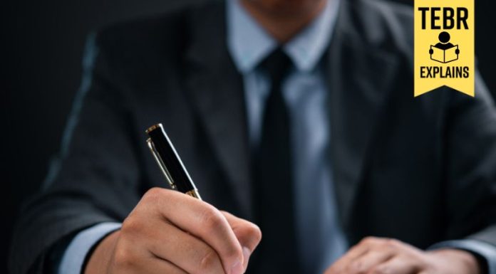 Businessman writing an elevator pitch