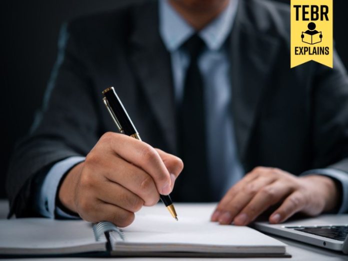 Businessman writing an elevator pitch