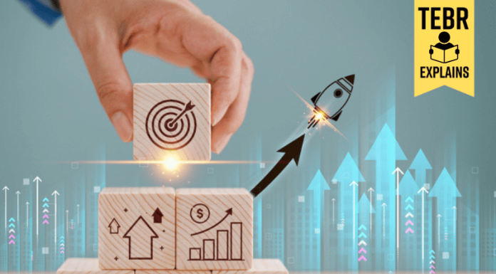 Rocket launch on wood cube, business investment and growth. Leadership creativity on new projects to wealth. Potential start-up progress concept. Big success idea, goal management, company strategy target