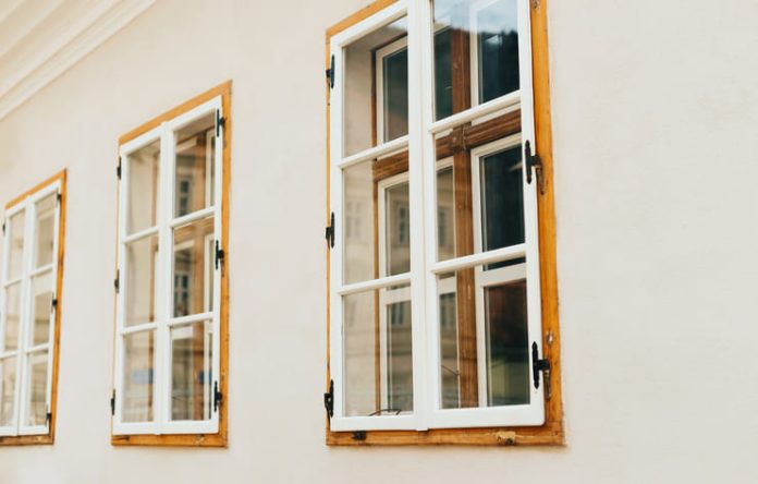 sash wooden windows in perspective on a white wall