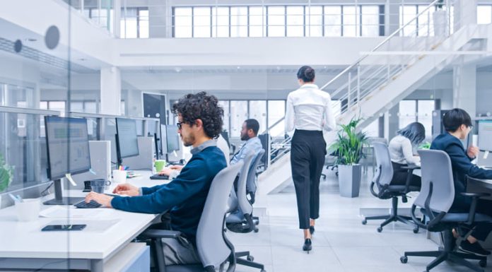 Beautiful Female Manager is Walking Pass Her Business Colleagues while working, experiments to optimize AI and algorithmic attachments.