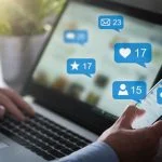 The Smart Way to Grow on Social Media (Without Posting Every Day) Like, share and post on social media. Hands holding smartphone with social media network icons.