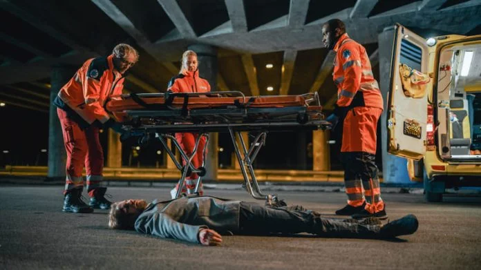 iStock-1291088674 (1) Emergency Care Assistants Arrived on the Scene of a Traffic Car Accident on a Street at Night.