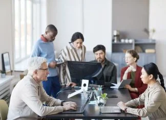 co-workers of all ages working at the office. Ageism in the workplace concept