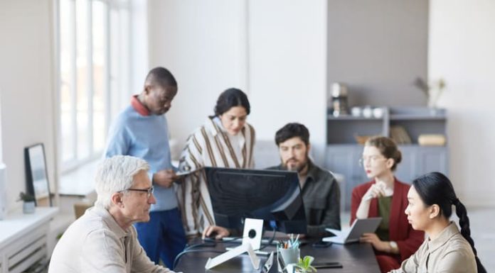 co-workers of all ages working at the office. Ageism in the workplace concept