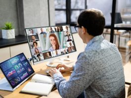 5 Tips for Successfully Managing Remote Teams Manager checking remote teams