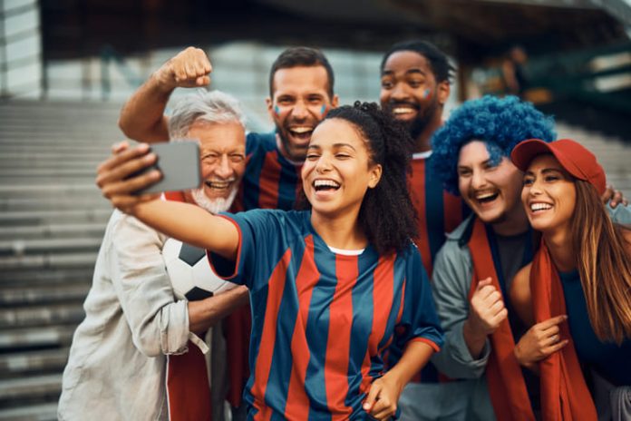 Player of sports and fans taking a selfie