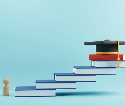 wooden people sign and graduation cap for MBA on book stairs