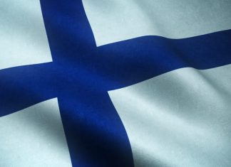 Closeup shot of realistic waving flag of Finland with interesting textures