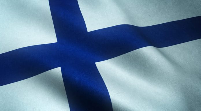 Closeup shot of realistic waving flag of Finland with interesting textures