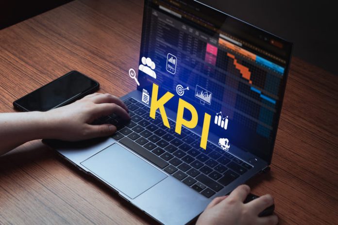 iStock-1695134607 (1) Woman use laptop with KPI holographic interface on screen.