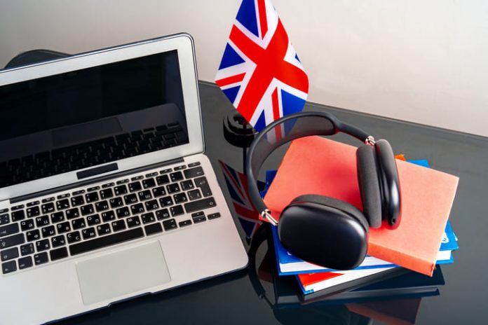 iStock-1757373273 (1) English language learning concept with books and flag of Great Britain