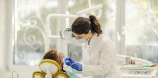 Why Istanbul Is the First Stop for Dental Tourism — And How to Choose the Right Clinic A female dentist is working with patient and fixing bad tooth while standing at dentist office.